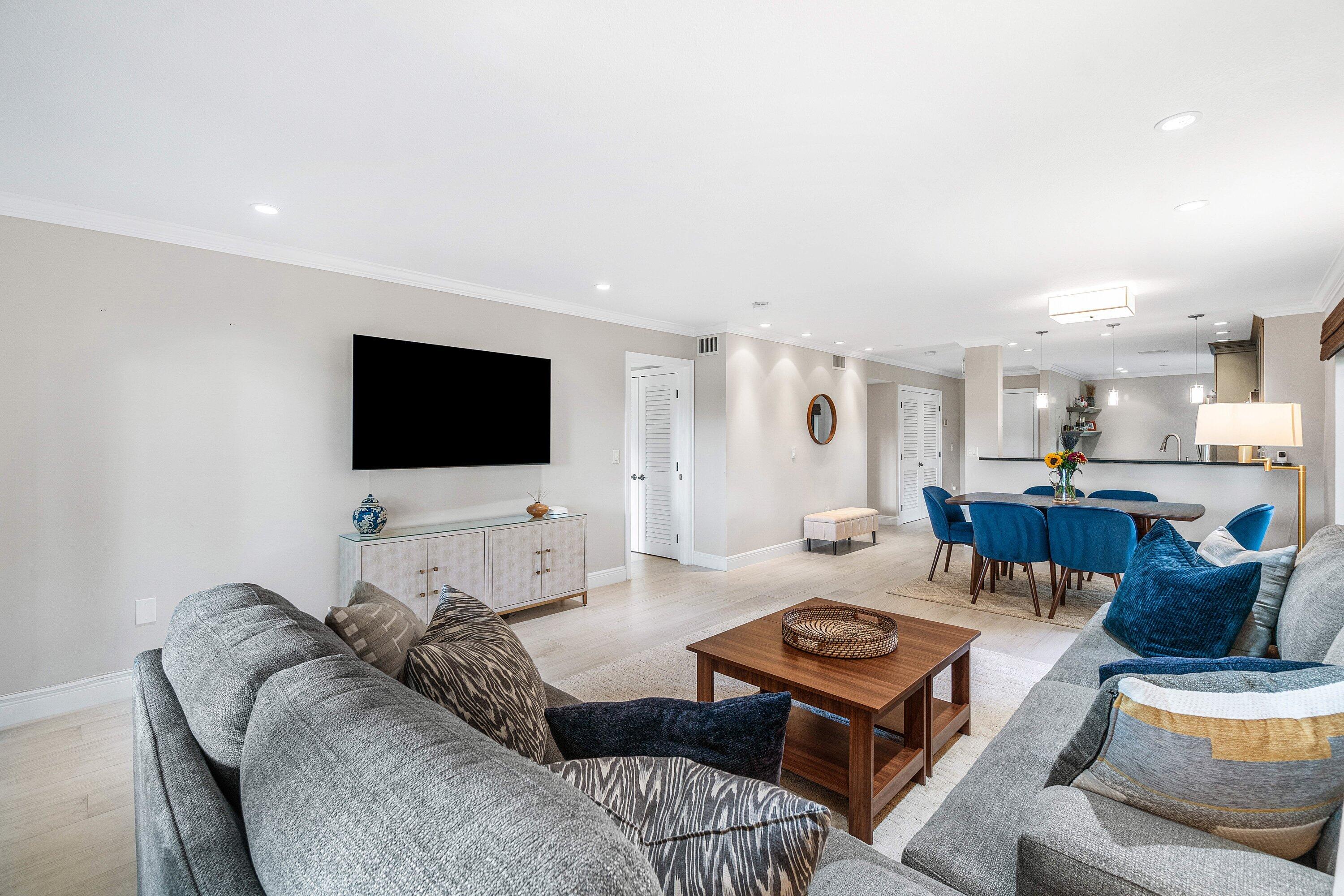 38 Southport Lane, Unit A Boynton Beach, FL 33436 - Photo 7 of 65 a living room with furniture and a flat screen tv