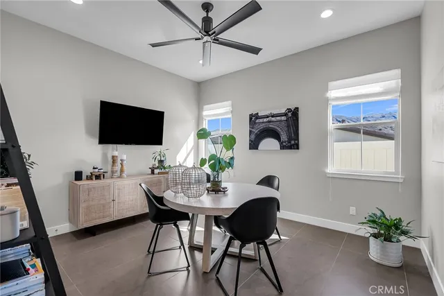 a view of a livingroom with furniture and a flat screen tv