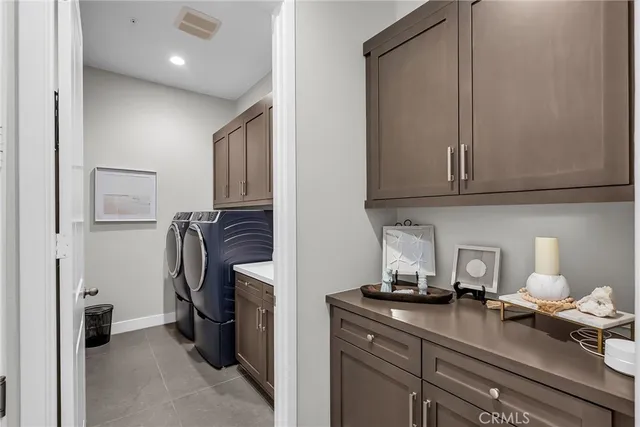 a kitchen with a refrigerator and cabinets