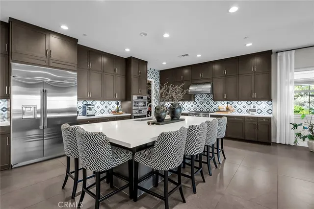 a kitchen with a table and chairs