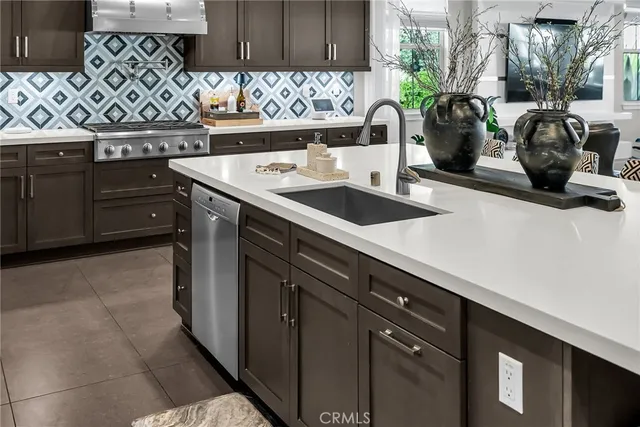 a kitchen with a sink and a stove