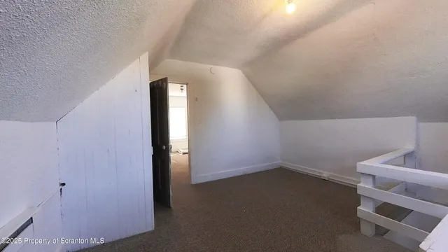 a view of livingroom and hallway with stairs