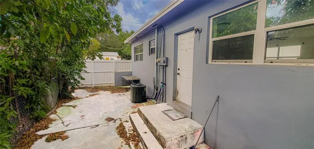 a view of a backyard of the house