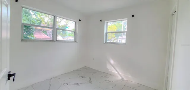 an empty room with windows