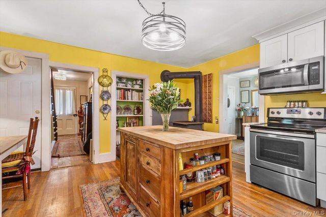 a kitchen with sink and cabinets