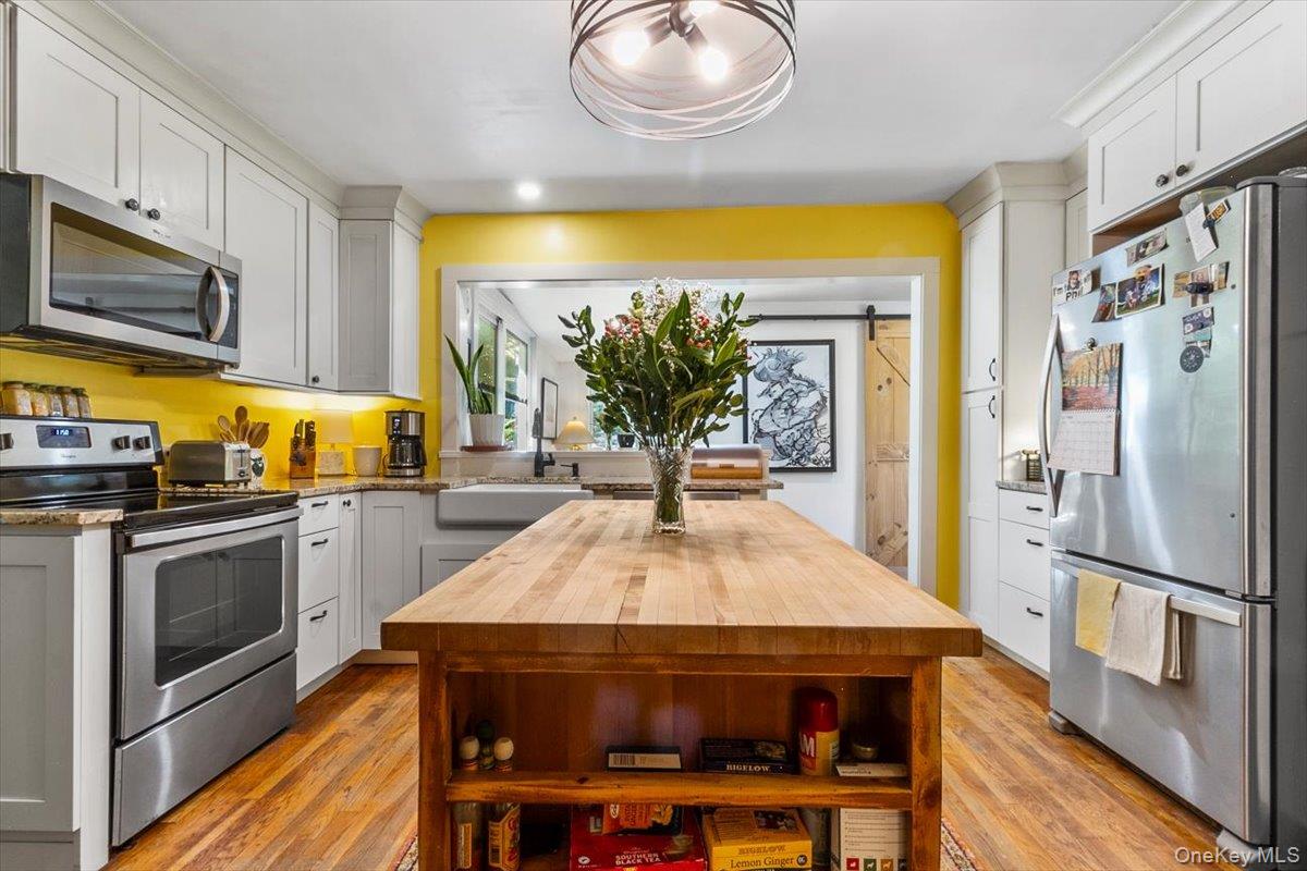 310 Oak Lane Newburgh, NY 12550 - Photo 17 of 34 a kitchen with stainless steel appliances a stove a refrigerator and a microwave