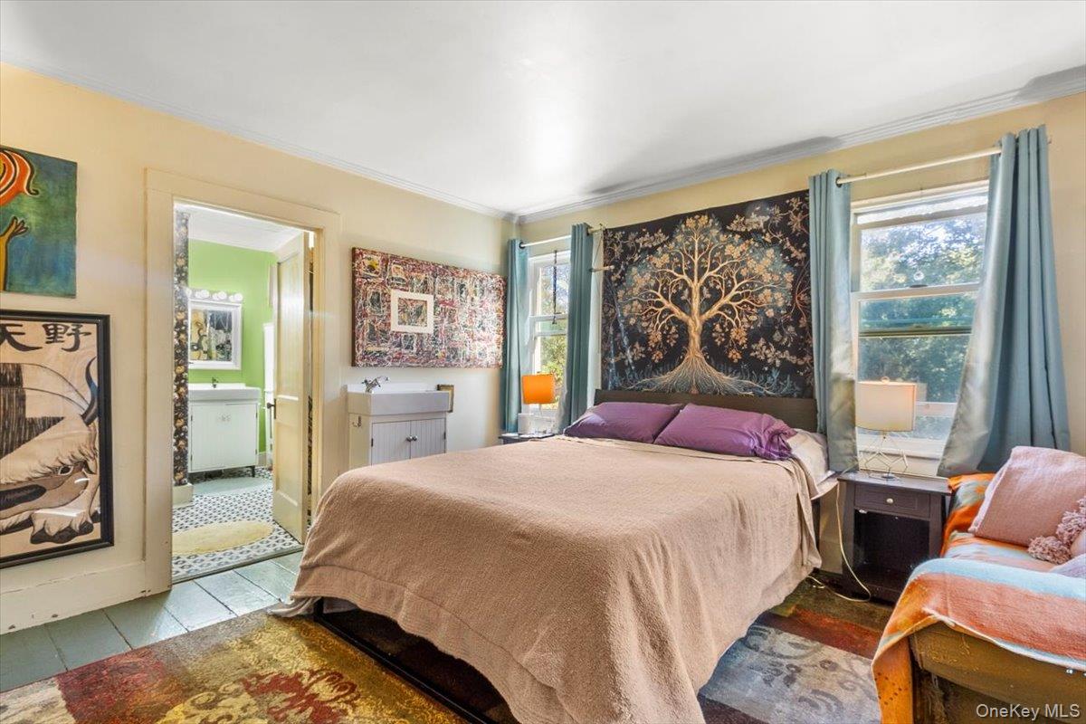 310 Oak Lane Newburgh, NY 12550 - Photo 25 of 34 a bedroom with a bed and wooden floor