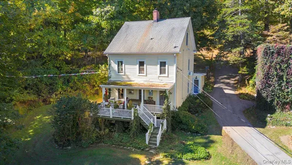 an aerial view of a house with swimming pool