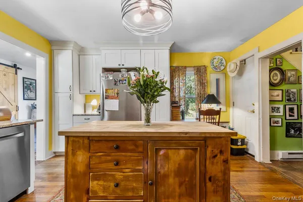 a kitchen with stainless steel appliances granite countertop a stove and a refrigerator
