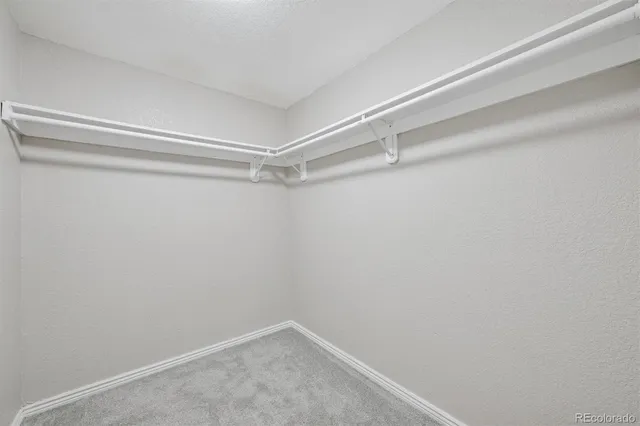 a view of an empty walk in closet