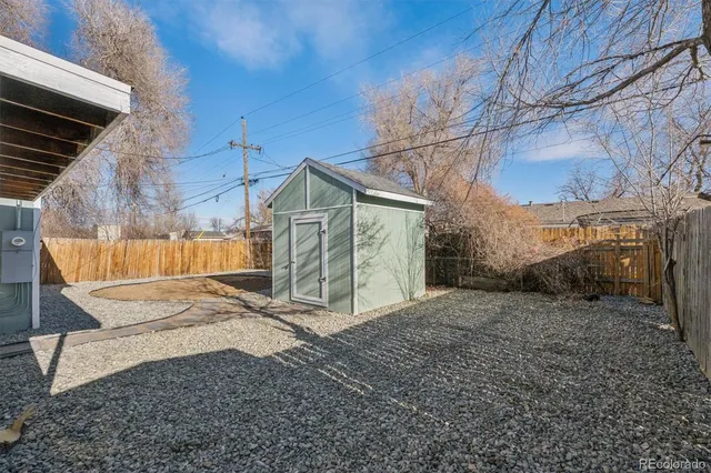 a view of a house with a snow in the yard