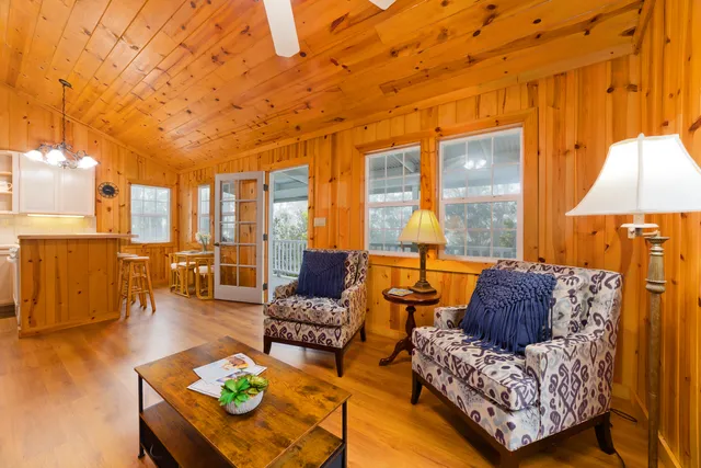 a kitchen that has a sink a stove and a microwave oven in it