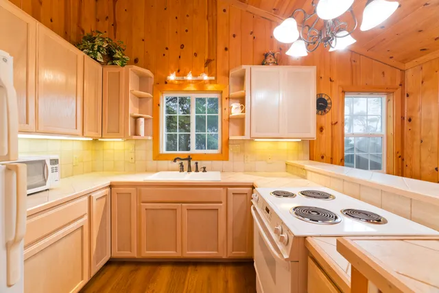 a bedroom with a bed and lamp