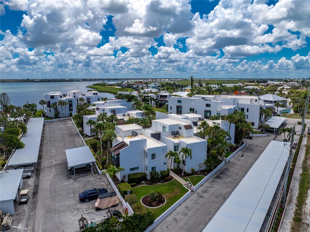 2955 North Beach Road, Unit B614 Englewood, FL 34223 - Photo 52 of 67 an aerial view of a house with garden space and ocean view