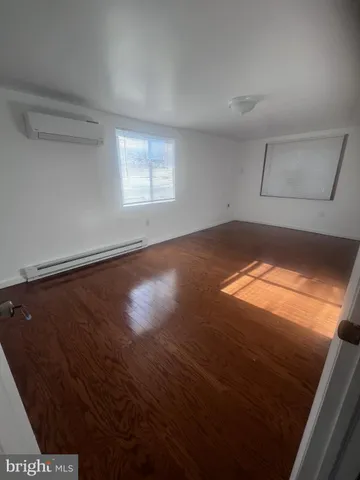 a view of wooden floor in an empty room