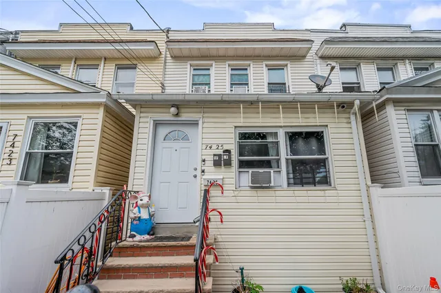 a front view of a house with a large windows