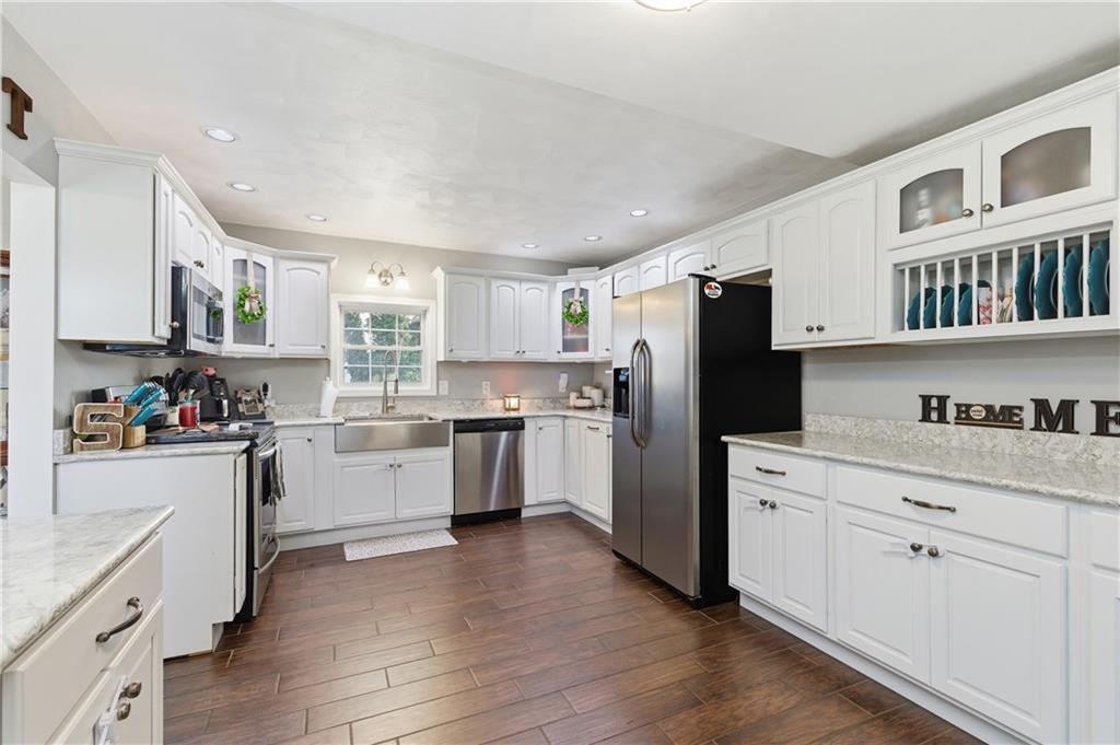 34 Cherry Farm Lane Dunbar, PA 15431 - Photo 11 of 22 a kitchen with granite countertop white cabinets and refrigerator