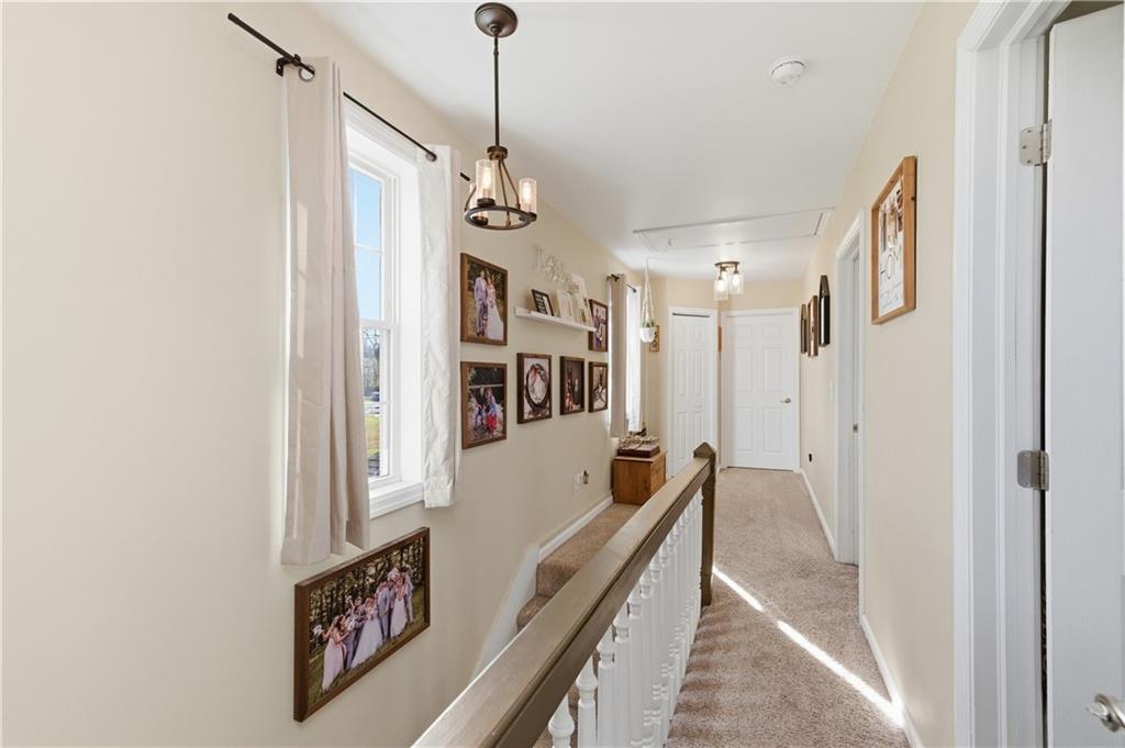 34 Cherry Farm Lane Dunbar, PA 15431 - Photo 18 of 22 a view of a hallway with wooden floor and staircase