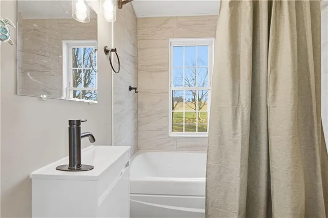 a bathroom with a sink and a bathtub
