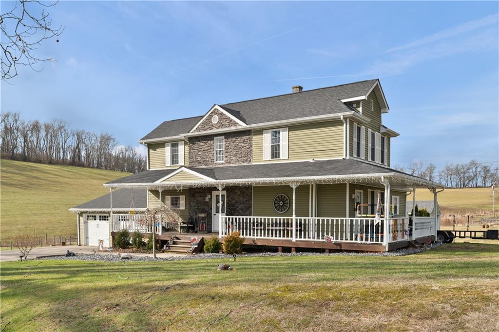 34 Cherry Farm Lane Dunbar, PA 15431 - Photo 2 of 22 a front view of a house with a garden