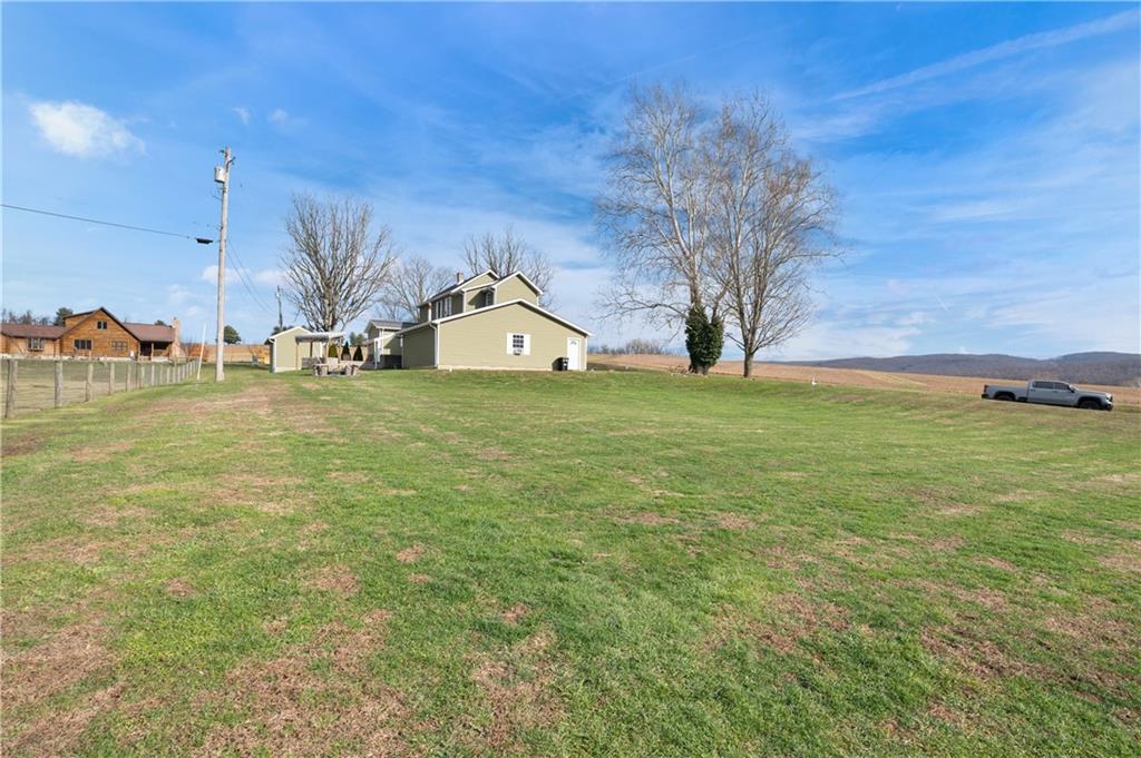 34 Cherry Farm Lane Dunbar, PA 15431 - Photo 6 of 22 a view of yard with swimming pool and seating area