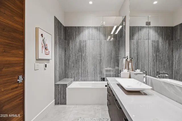 a bathroom with a sink a bathtub and a shower