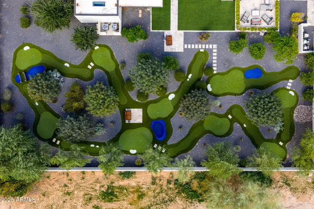 an aerial view of residential house and swimming pool