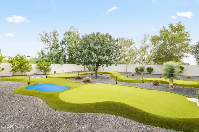 a view of a swimming pool with an outdoor space and seating area