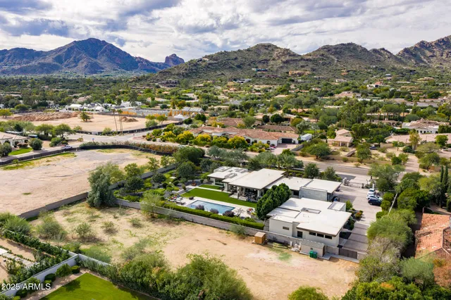 an aerial view of residential house with outdoor space and river
