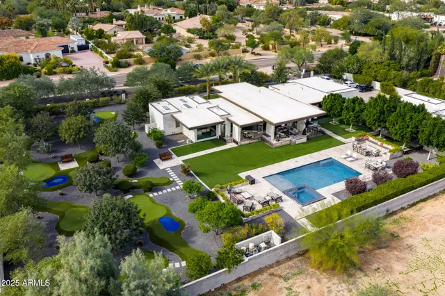 an aerial view of a house with a garden