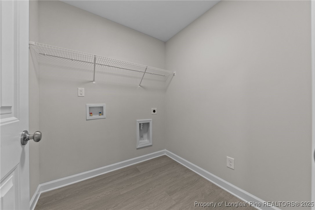 509 Watauga Lane Aberdeen, NC 28315 - Photo 18 of 29 a view of a room with racks on the wall