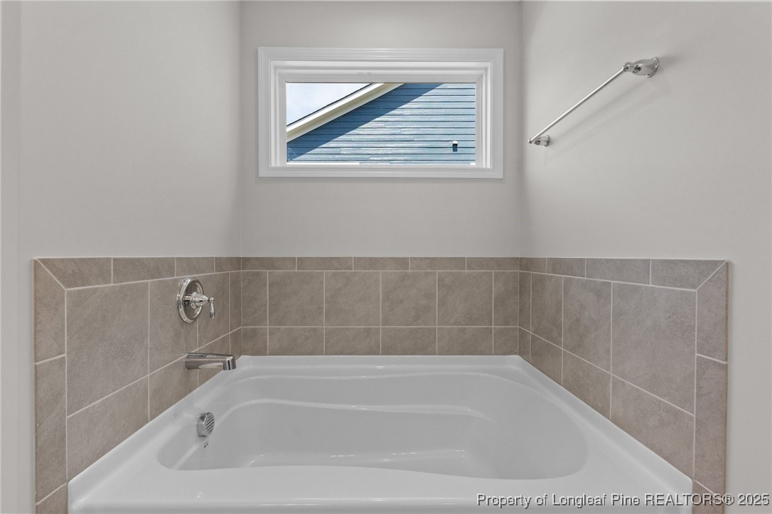 509 Watauga Lane Aberdeen, NC 28315 - Photo 27 of 29 a bath tub sitting next to a window
