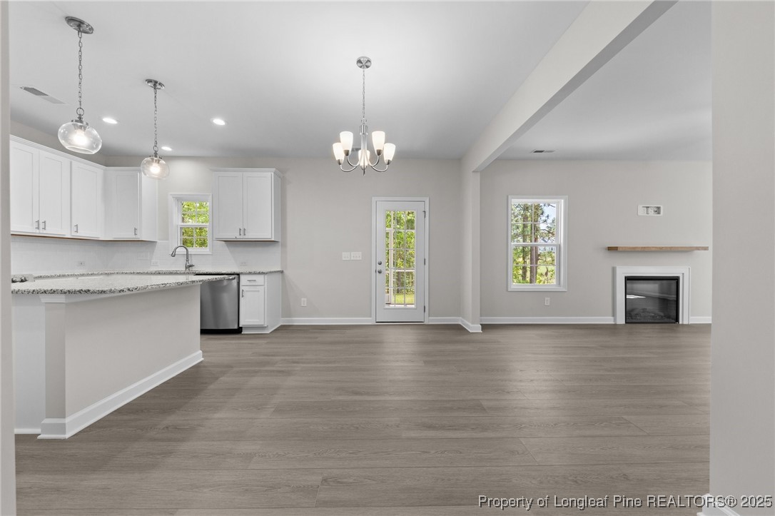 509 Watauga Lane Aberdeen, NC 28315 - Photo 9 of 29 a view of a kitchen with a stove cabinets and a kitchen