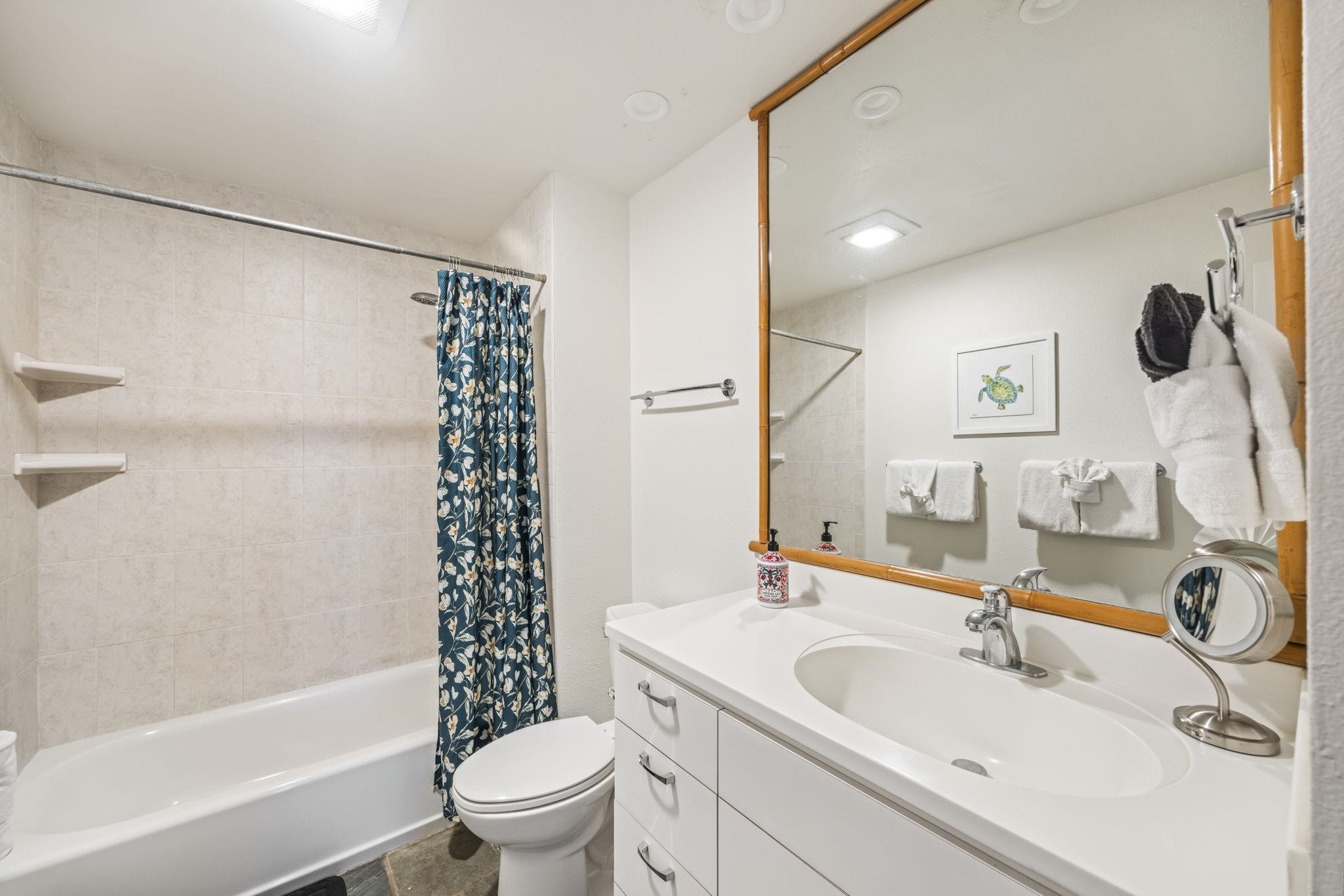 3959 Lower Honoapiilani Road, Unit A205 Lahaina, HI 96761 - Photo 13 of 36 a bathroom with a sink toilet and shower
