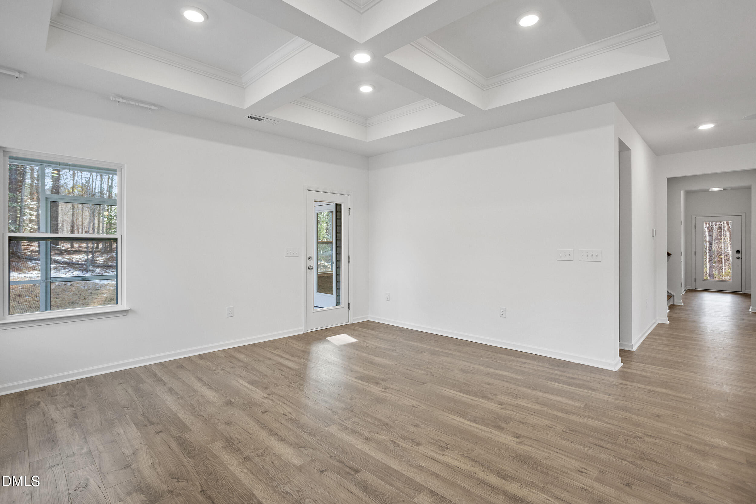 138 Sacred Fire Road Louisburg, NC 27549 - Photo 13 of 28 wooden floor in an empty room with a window