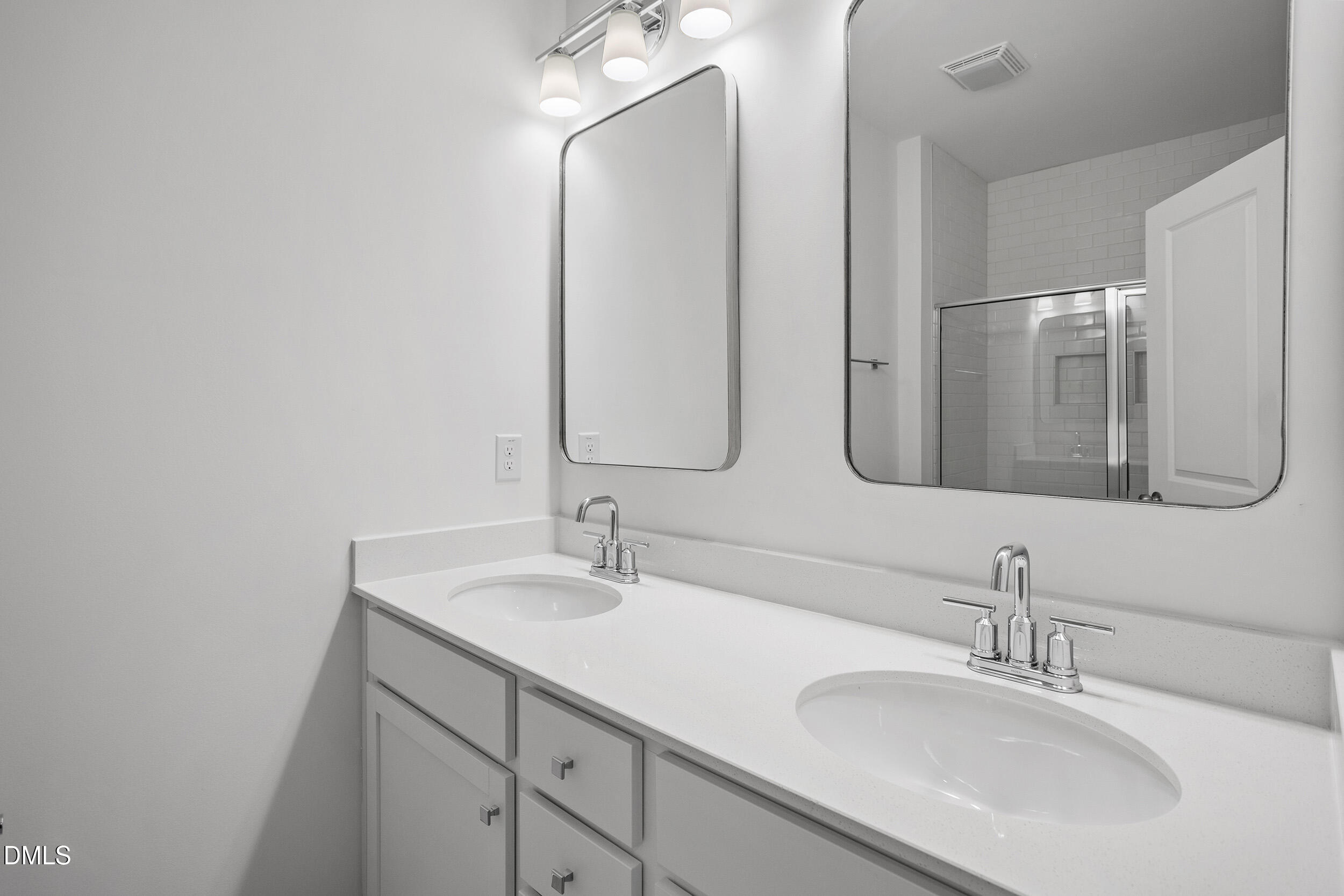 138 Sacred Fire Road Louisburg, NC 27549 - Photo 18 of 28 a bathroom with a double vanity sink and mirror
