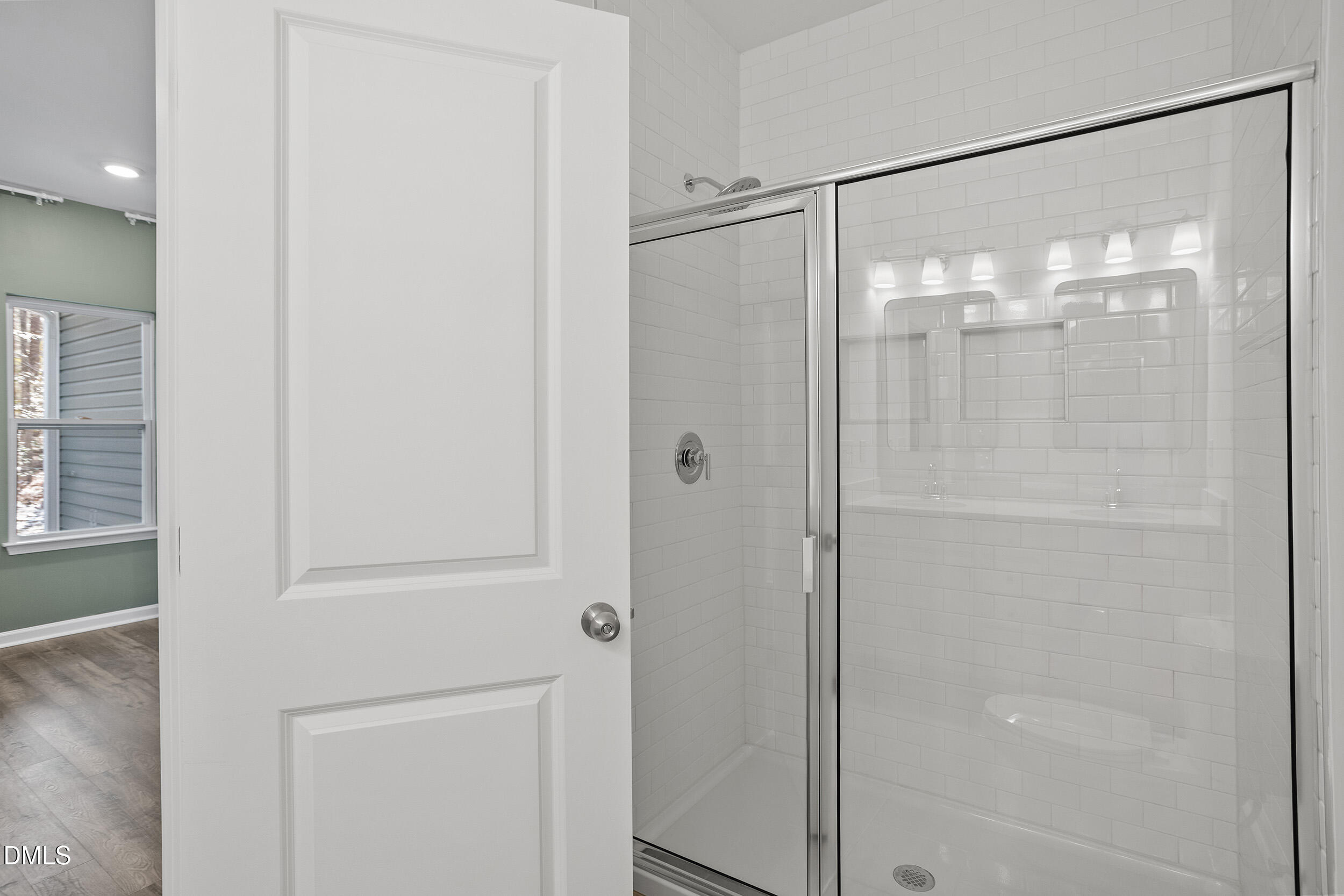 138 Sacred Fire Road Louisburg, NC 27549 - Photo 19 of 28 a bathroom with a glass shower door
