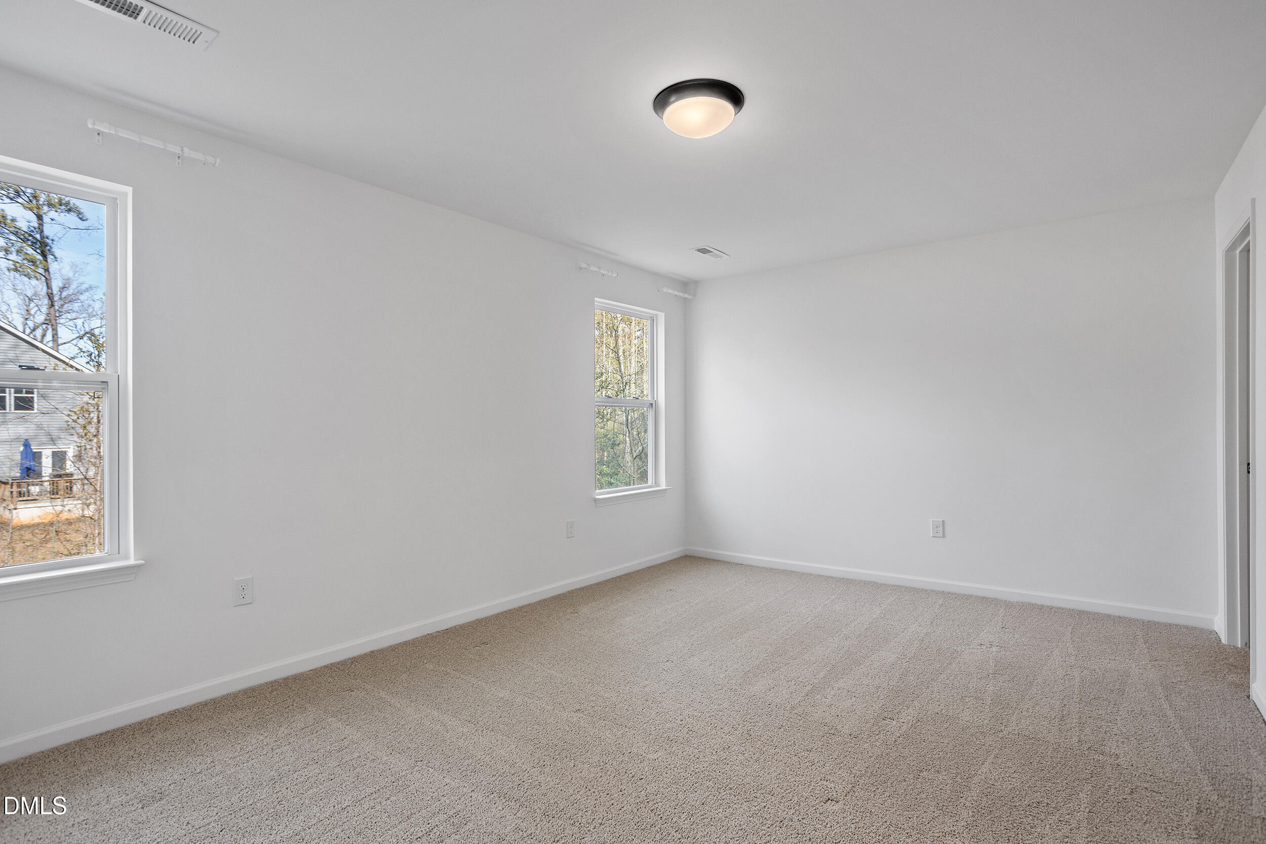 138 Sacred Fire Road Louisburg, NC 27549 - Photo 23 of 28 an empty room with windows
