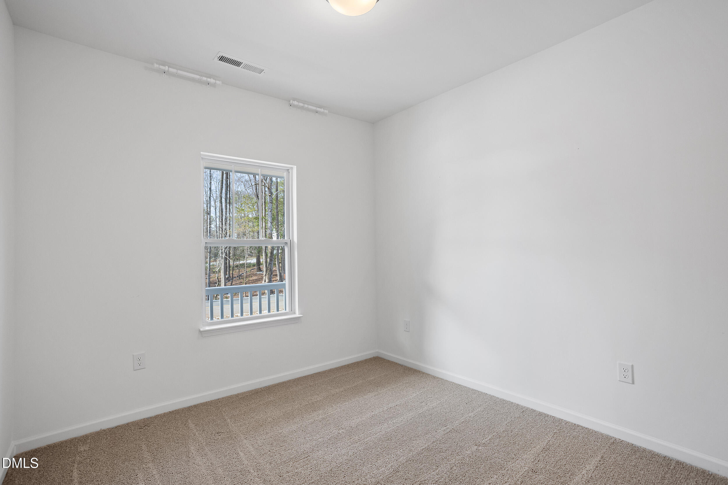 138 Sacred Fire Road Louisburg, NC 27549 - Photo 5 of 28 an empty room with windows