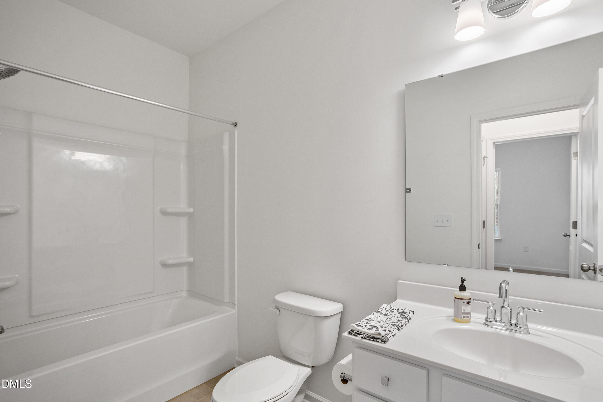 138 Sacred Fire Road Louisburg, NC 27549 - Photo 7 of 28 a bathroom with a sink toilet and shower