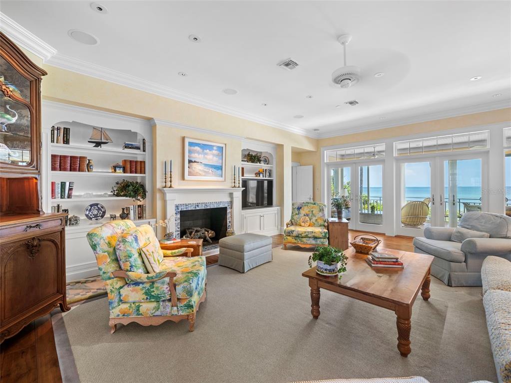 2979 Shore Lane Boca Grande, FL 33921 - Photo 16 of 57 a living room with furniture fireplace and a large window