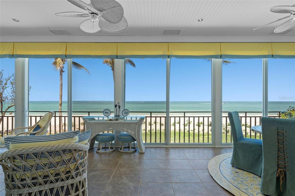 2979 Shore Lane Boca Grande, FL 33921 - Photo 20 of 57 a balcony with furniture and a table