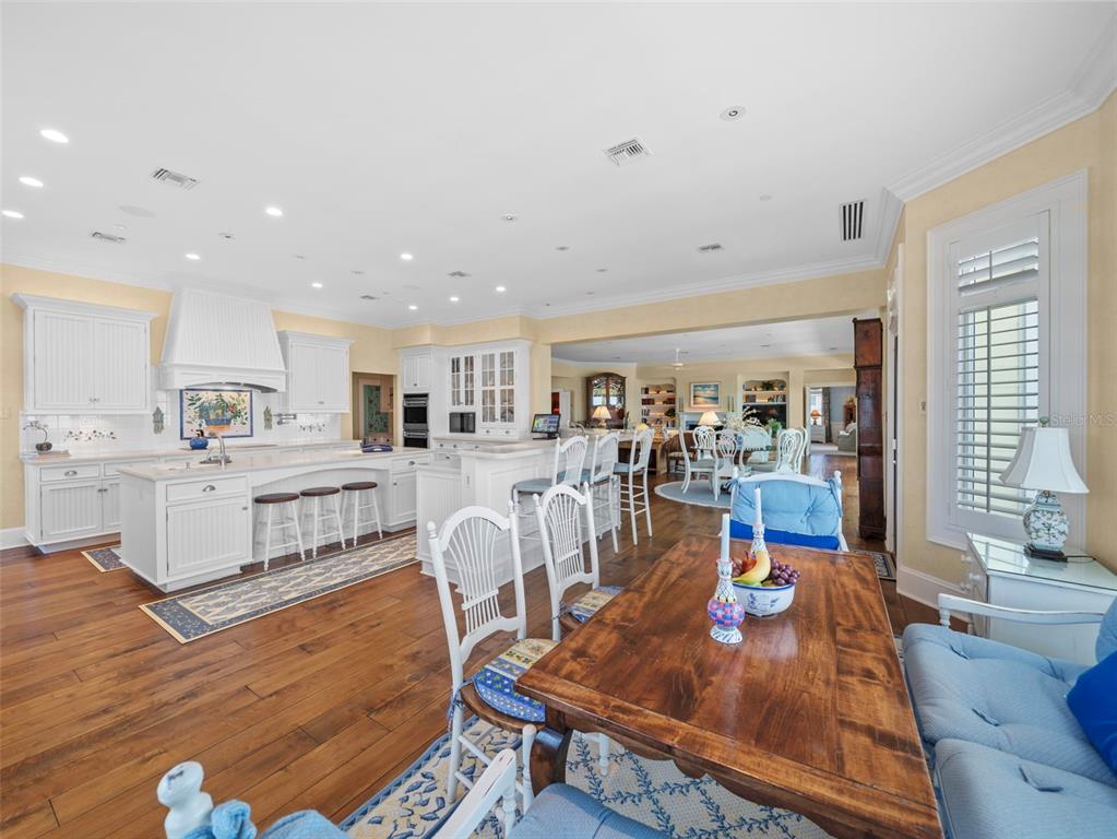 2979 Shore Lane Boca Grande, FL 33921 - Photo 25 of 57 a living room with furniture kitchen view and a wooden floor