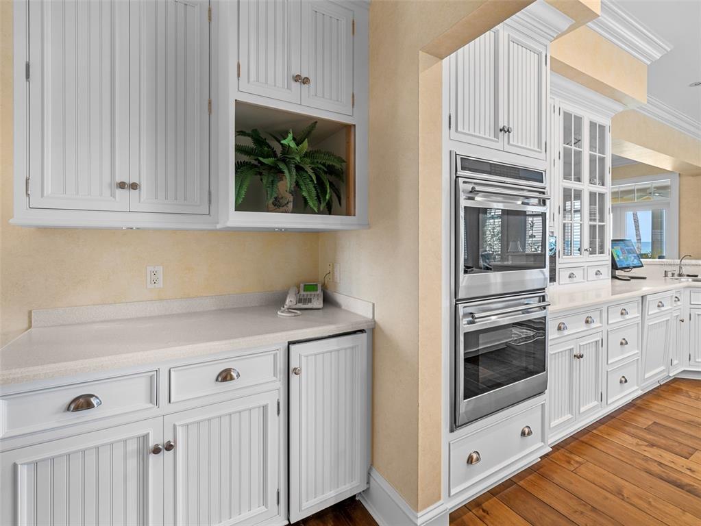 2979 Shore Lane Boca Grande, FL 33921 - Photo 30 of 57 a kitchen with stainless steel appliances granite countertop a sink and a stove