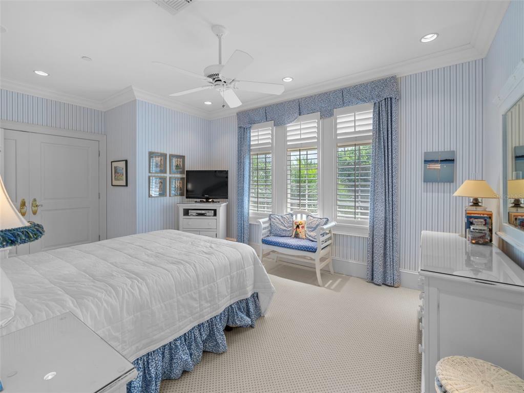 2979 Shore Lane Boca Grande, FL 33921 - Photo 41 of 57 a bedroom with a bed and a television