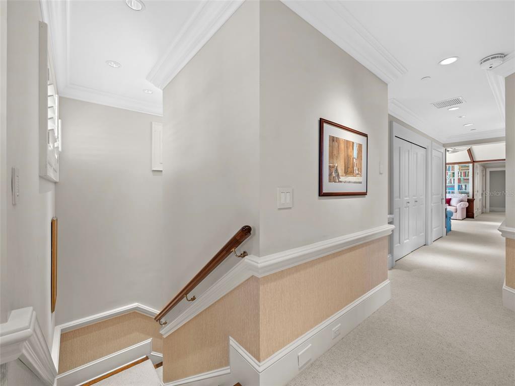 2979 Shore Lane Boca Grande, FL 33921 - Photo 43 of 57 a view of a hallway with closet and wooden floor