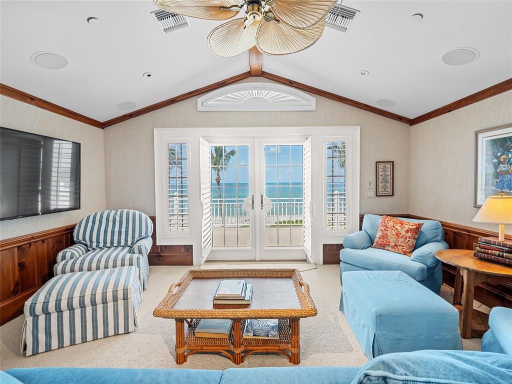 2979 Shore Lane Boca Grande, FL 33921 - Photo 45 of 57 a living room with furniture and a floor to ceiling window