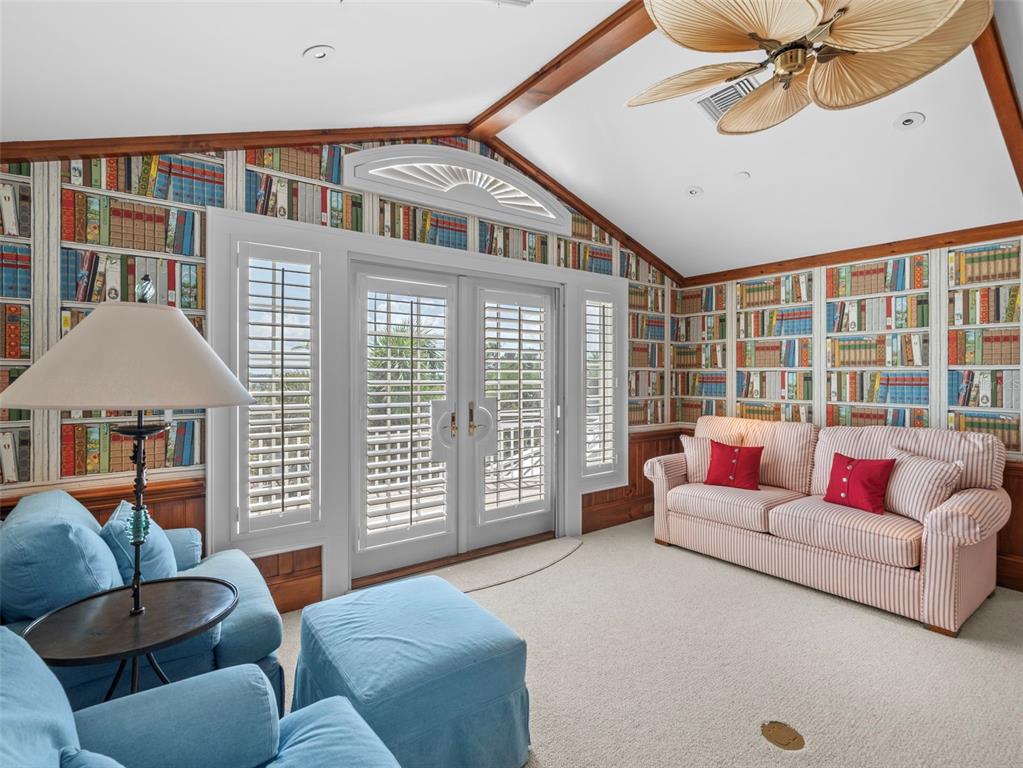 2979 Shore Lane Boca Grande, FL 33921 - Photo 46 of 57 a living room with furniture and a floor to ceiling window