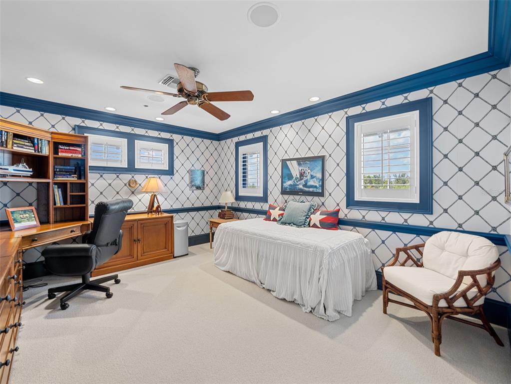 2979 Shore Lane Boca Grande, FL 33921 - Photo 54 of 57 a bedroom with furniture and a large window