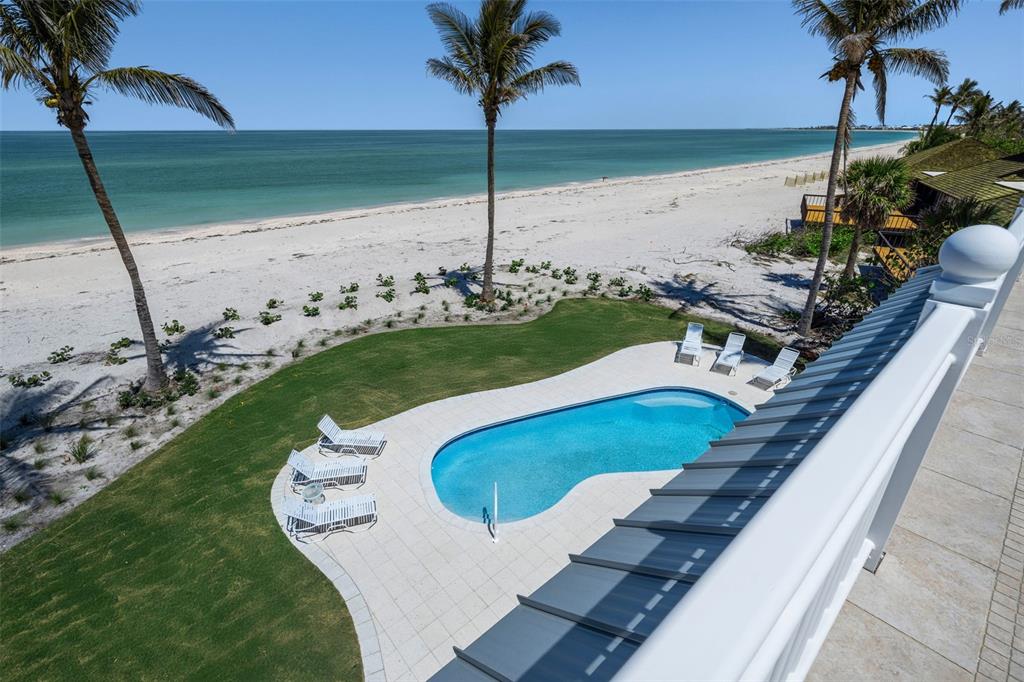 2979 Shore Lane Boca Grande, FL 33921 - Photo 9 of 57 a view of a swimming pool with a yard